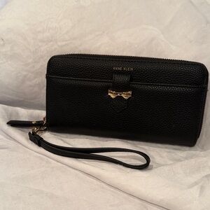 Anne Klein Black Pebbled Wristlet with Gold Bow Accent